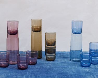 Pink, beige, and blue Night + Day Carafes and Short Night + Day Glasses