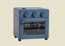 Blue toaster oven on a beige background