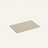Checkered oven mat on a beige background