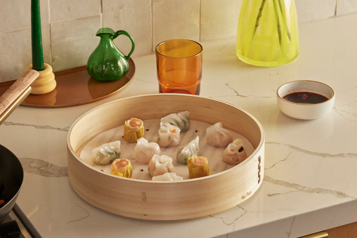 Bamboo steamer with dumplings inside