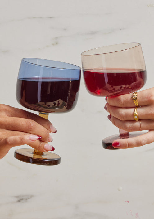 Two people clanging their Party Coupes together