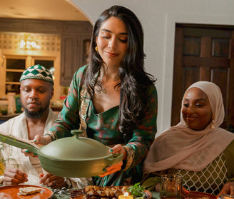 our place founder shiza shahid serving food with green always pan