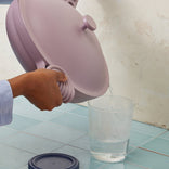 Straining out water from a purple Large Always Pan