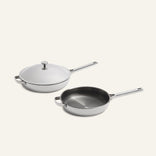 Titanium Pro Always Pan Duo 2.0 featuring two non-toxic stainless steel frying pans, one with a matching lid and one open.