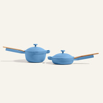 The Mini Cookware Duo, featuring two blue mini multifunctional pots with lids and wooden handles, both bestsellers, is displayed side by side against a plain light background.