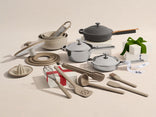 Set of kitchen utensils and cookware on a light background