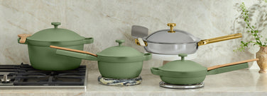 green perfect pot on stove, green mini perfect pot, mini always pan and gold titanium always pan pro on counter
