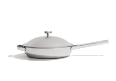 Stainless steel skillet with a domed lid and a long handle.