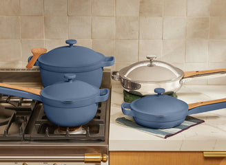 chrome titanium always pan pro and blue mini always pan on counter. Blue perfect pot and mini perfect pot on stove