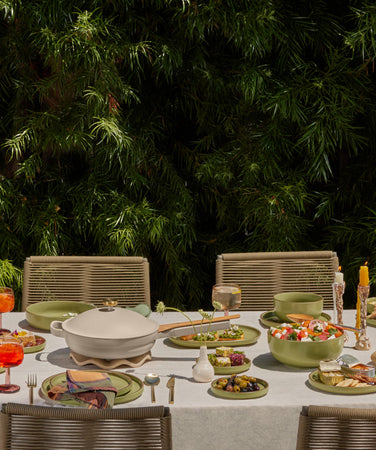 our place dinnerware, drinkware and always pan set on table outside