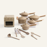 A cream oven and a set of cream cookware on a white background